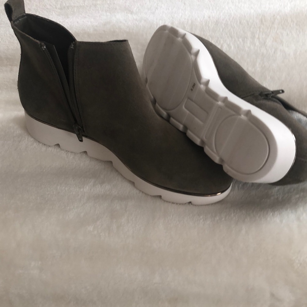 Brand new trendy Alex Marie boots, rubber soled with zippers down the side